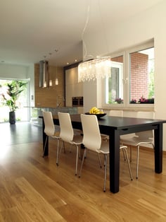 Dining room with dark table and bright chairs.jpeg