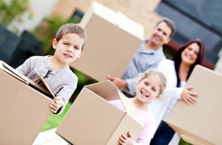 Family moving home and carrying cardboard boxes.jpeg