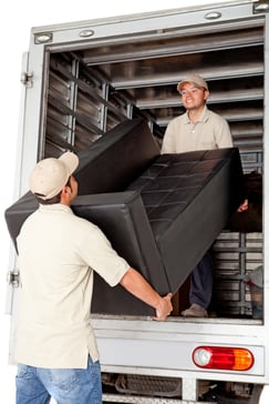 Men working for a moving services company unloading a sofa from a truck.jpeg