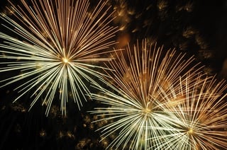 Three bursts of fireworks in proximity.jpeg